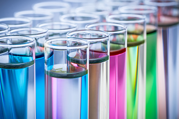multiple test tubes of colorful liquids