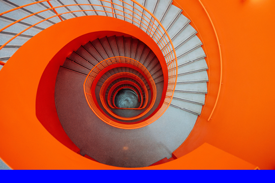 Gray and orange spiral stairs (credit: Getty Images)
