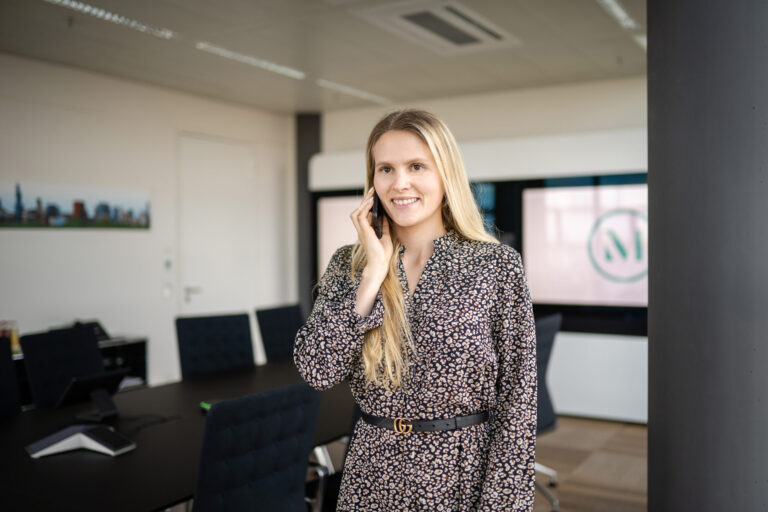 A staff professional takes a call in a meeting room at one of the firm’s Germany offices. (credit: McDermott Will & Schulte)