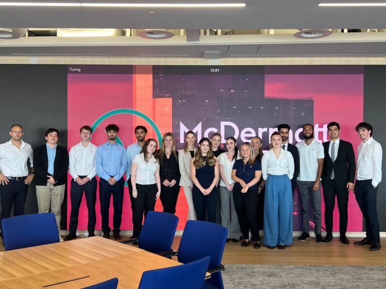 London trainees pose for a group photo during a team event (credit: McDermott Will & Schulte)