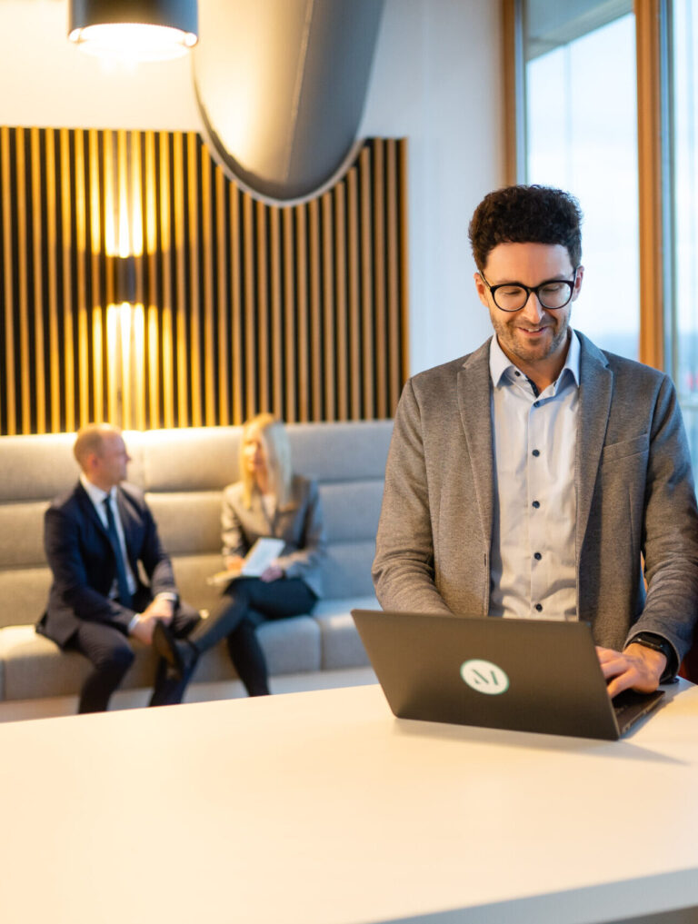 Candid photo of employees working in the common space of one of the firm’s Germany offices. (credit: McDermott Will & Schulte)