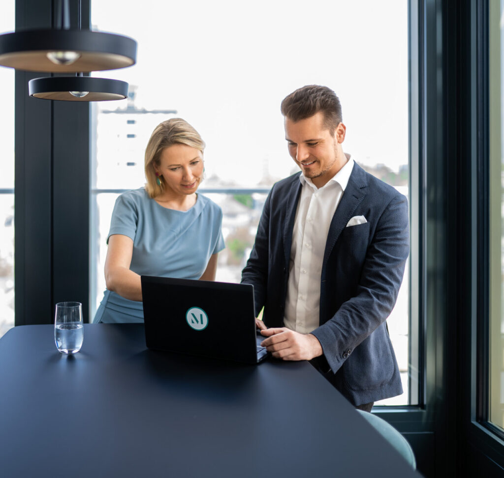Candid photo of employees working in a meeting space at one of the firm’s Germany offices. (credit: McDermott Will & Schulte)