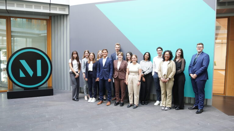 Interns pose for a photo outside one of the firm’s Germany offices. (credit: McDermott Will & Schulte)