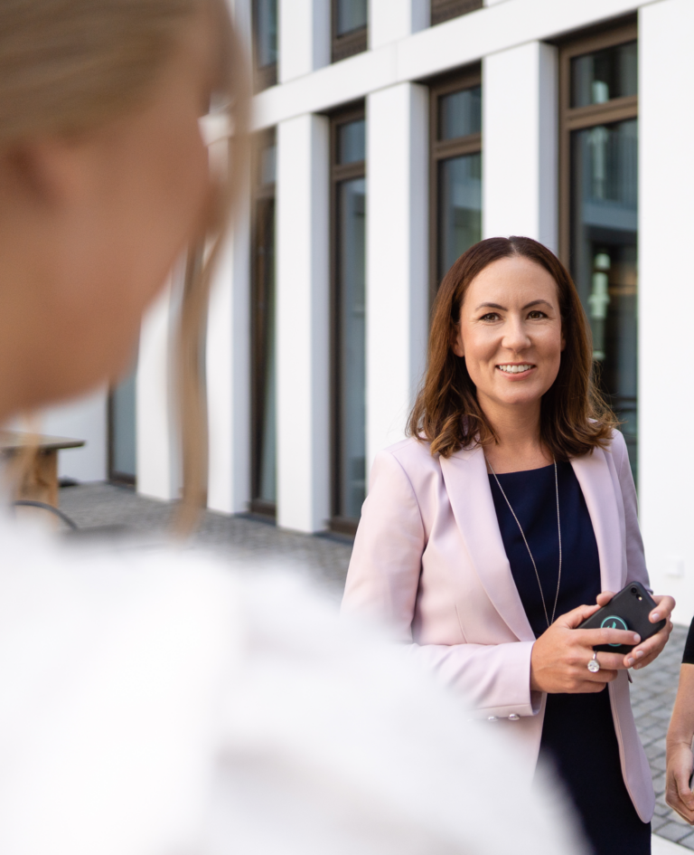 Employees mingle outside of one of the firm’s Germany offices. (credit: McDermott Will & Schulte)