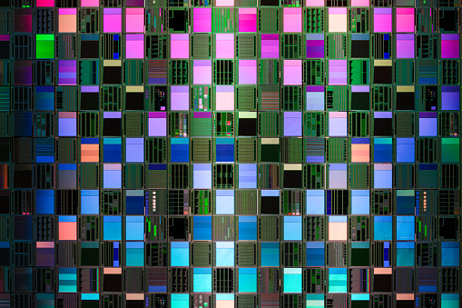 Iridescent Semiconductor Wafer Extreme Close-up Studio Shot.
